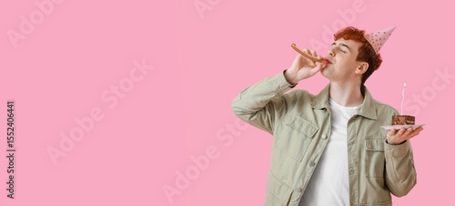 Young man with party blower and piece of birthday cake on pink background wit...