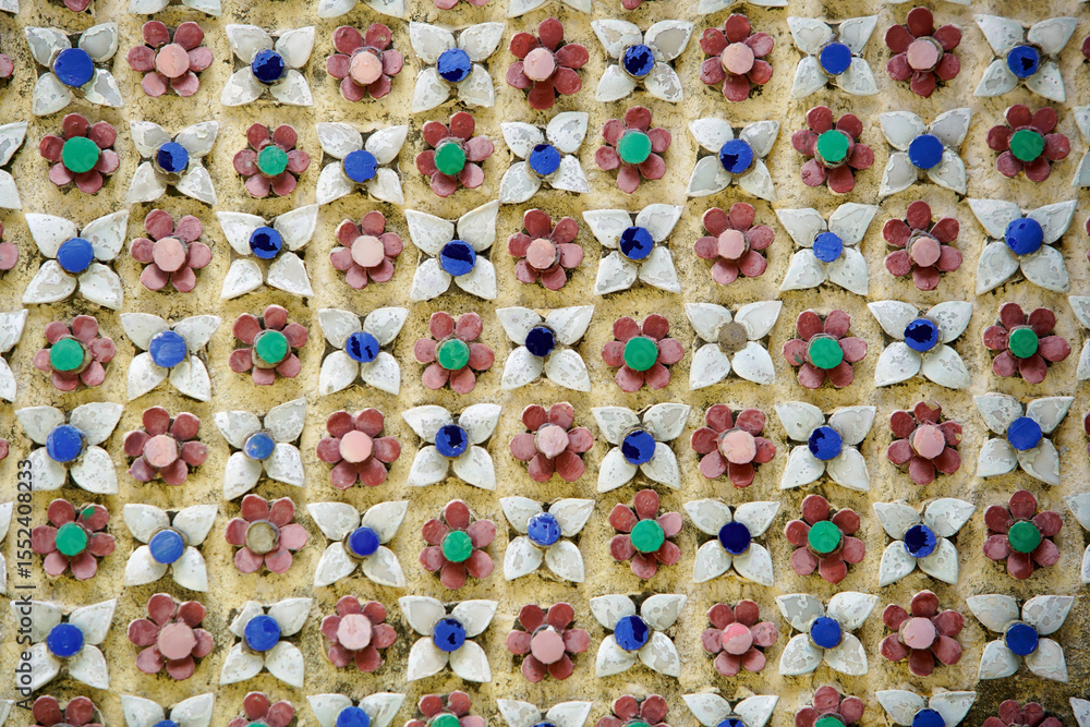 Fototapeta premium Colorful Floral Pattern with Geometric Design on Wall Surface
