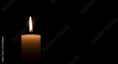 bereavement candle. Minimalist memorial candle with warm flame over deep black backdrop, perfect for mourning content or in memoriam design.