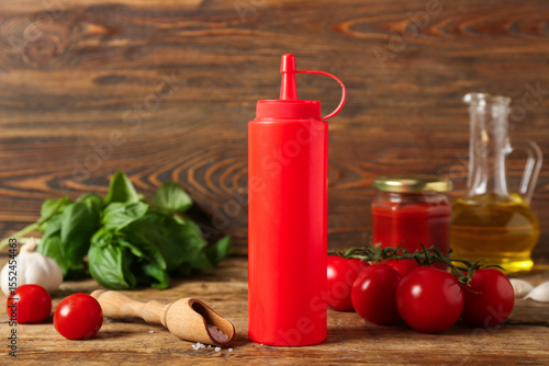 Red squeeze bottle with ket...