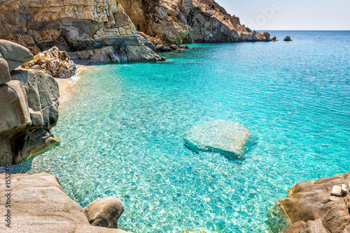 Wallpaper Mural Seychelles beach at Magganitis, Ikaria island Greece by Icarian sea with crystal clear green turquoise water by rocky cliffs coast cove Torontodigital.ca