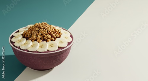 Acai Bowl Delight: Granola and Banana Topping on Vibrant Purple Base