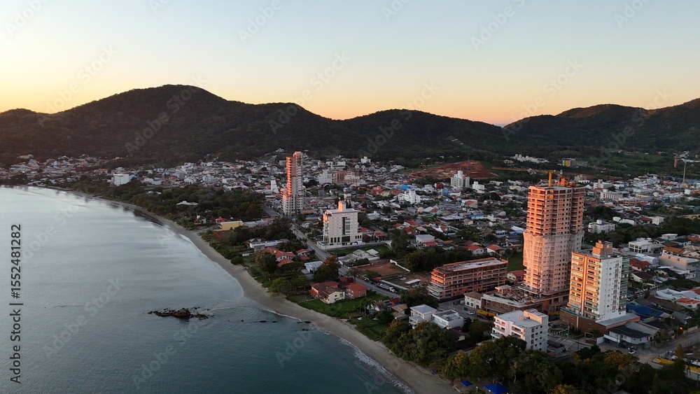 Fototapeta premium Sunrise and Sunset by the Sea – Calm Waters and Coastal Light in Brazi