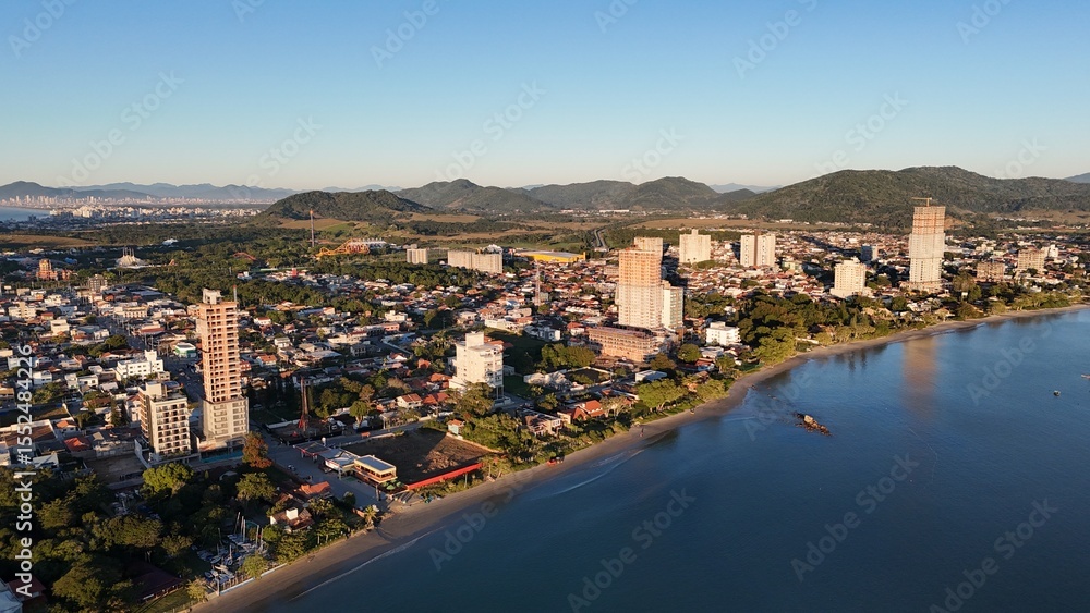 Fototapeta premium Sunrise and Sunset by the Sea – Calm Waters and Coastal Light in Brazi