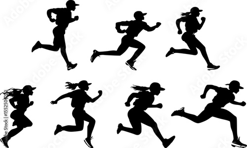 Silhouettes of female baseball players running during a game