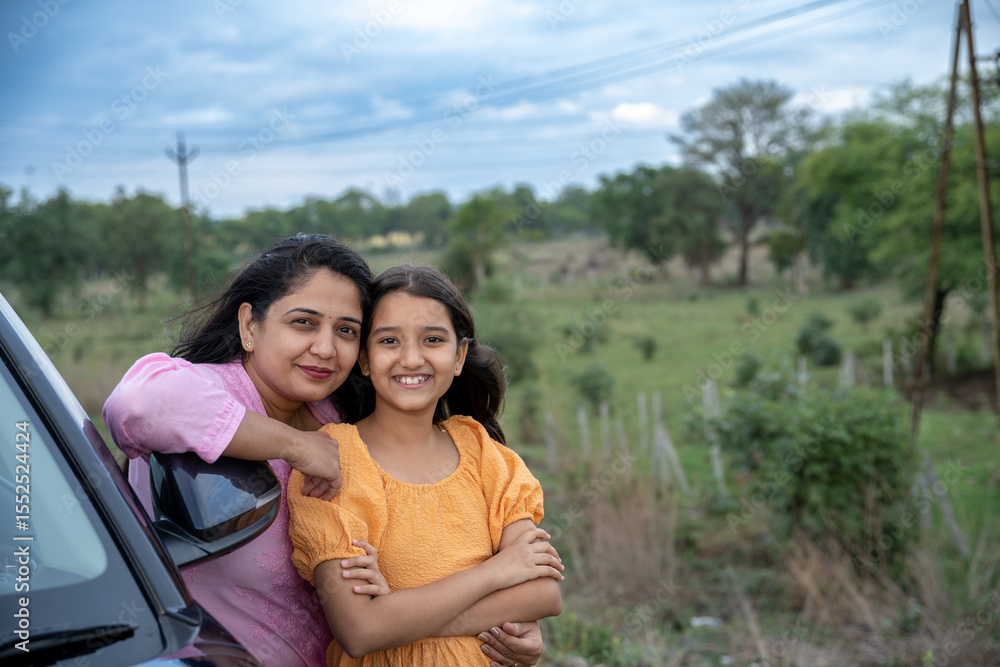 An Indian mother and her daughter embrace, celebrating the warmth of family and love An Indian mother and her daughter embrace, celebrating the warmth of family and love