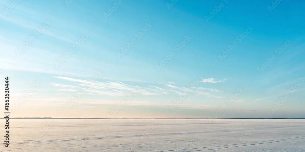 Fototapeta premium Serene Winter Landscape Vast Snowfield Under a Clear Blue Sky