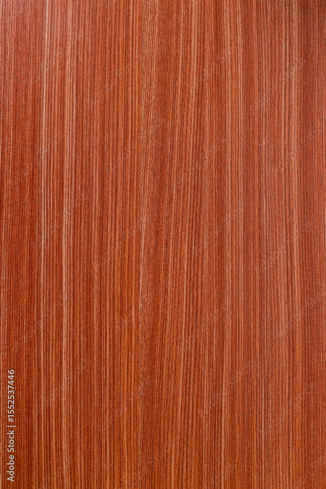 Naklejka premium Close Up Of Reddish Brown Wooden Surface Featuring Prominent Fine Vertical Grain Lines