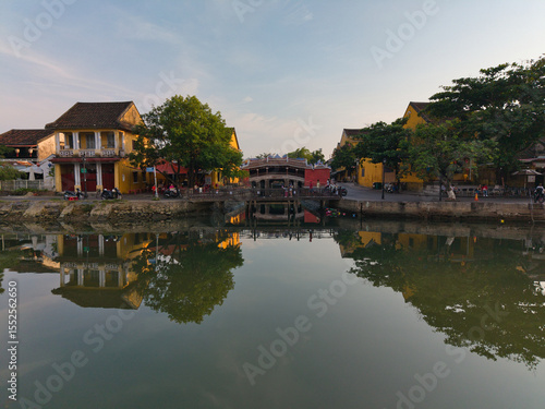 Wallpaper Mural Aerial drone footage of the iconic Japanese Covered Bridge (Chua Cau) in Hoi An Ancient Town, Vietnam, captured in daylight. This UNESCO World Heritage Site Torontodigital.ca