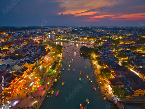 Wallpaper Mural Aerial view of Hoi An old town or Hoian ancient town in evening. Royalty high-quality free stock image top of Hoai river and boat tour night traffic. One of the most popular touristic destination Torontodigital.ca