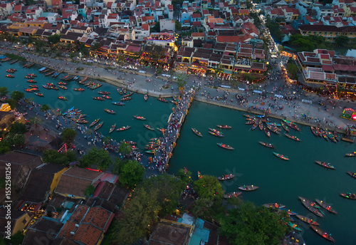 Wallpaper Mural Aerial view of Hoi An old town or Hoian ancient town in evening. Royalty high-quality free stock image top of Hoai river and boat tour night traffic. One of the most popular touristic destination Torontodigital.ca