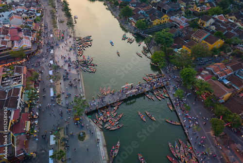 Wallpaper Mural Aerial view of Hoi An old town or Hoian ancient town in evening. Royalty high-quality free stock image top of Hoai river and boat tour night traffic. One of the most popular touristic destination Torontodigital.ca