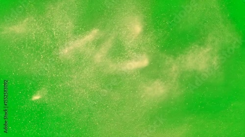 Flying dust particles on green screen background with natural motion and soft texture, ideal for overlays, transitions, atmospheric effects, or cinematic scene enhancements.