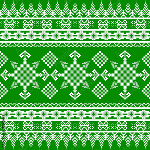 White cross-stitch ethnic seamless pattern on a green background. Pixel pattern. Tribal ornament. Folk motif. Ukrainian embroidery. Ideas for carpet, rug, wall tapestry, table runner, elaborate border