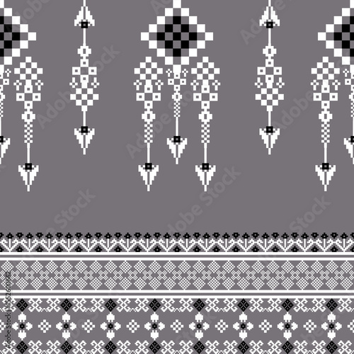 Grey and white cross-stitch seamless pattern with ethnic ornament. Boho style. Vector illustration. Ideas for carpet, rug, wall tapestry, table runner, elaborate borders, and textiles. Pixel pattern.
