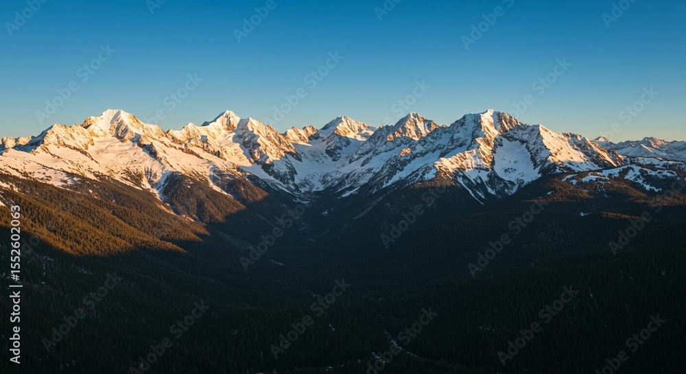 Obraz premium Majestic mountain range at sunrise