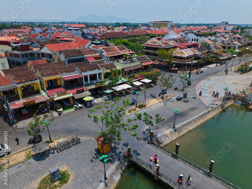 Wallpaper Mural Aerial drone shot of Hoi An’s historic architecture, colorful rooftops, and traditional streets. Ideal for content related to Vietnam, Southeast Asia, heritage, and tourism Torontodigital.ca