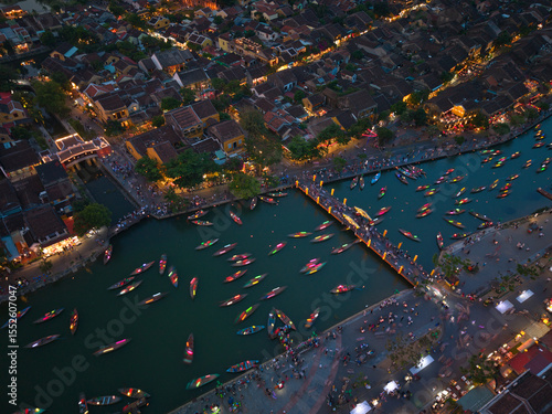 Wallpaper Mural Drone footage capturing the Hoi An Lantern Festival at night, with floating lanterns, boats, and tourists along the river. Ideal for cultural, travel, and festive content Torontodigital.ca