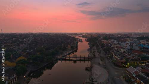 Wallpaper Mural Aerial view of Hoi An old town or Hoian ancient town in sunrise. Royalty high-quality free stock top view of Hoai river and city in the morning. One of the most popular touristic destinations Torontodigital.ca