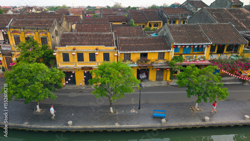 Wallpaper Mural Aerial drone shot of Hoi An’s historic architecture, colorful rooftops, and traditional streets. Ideal for content related to Vietnam, Southeast Asia, heritage, and tourism Torontodigital.ca