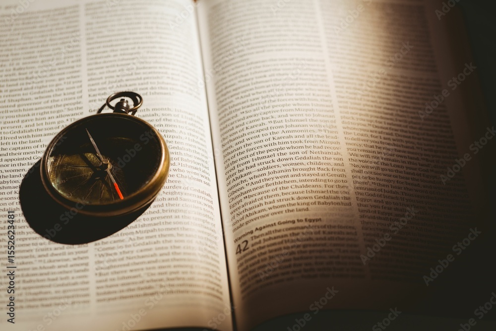 Naklejka premium Pocket watch on open book