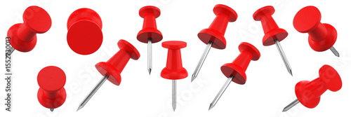A collection of red push pins scattered in various orientations, commonly used for pinning notes or papers.