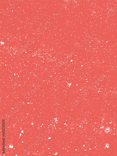 A red surface is splattered with many tiny white dots creating a textured, speckled pattern. The distribution of dots is varied and dense throughout the image.