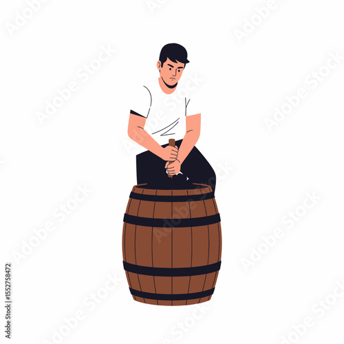 Farmer crushing grapes in a wooden barrel for wine production