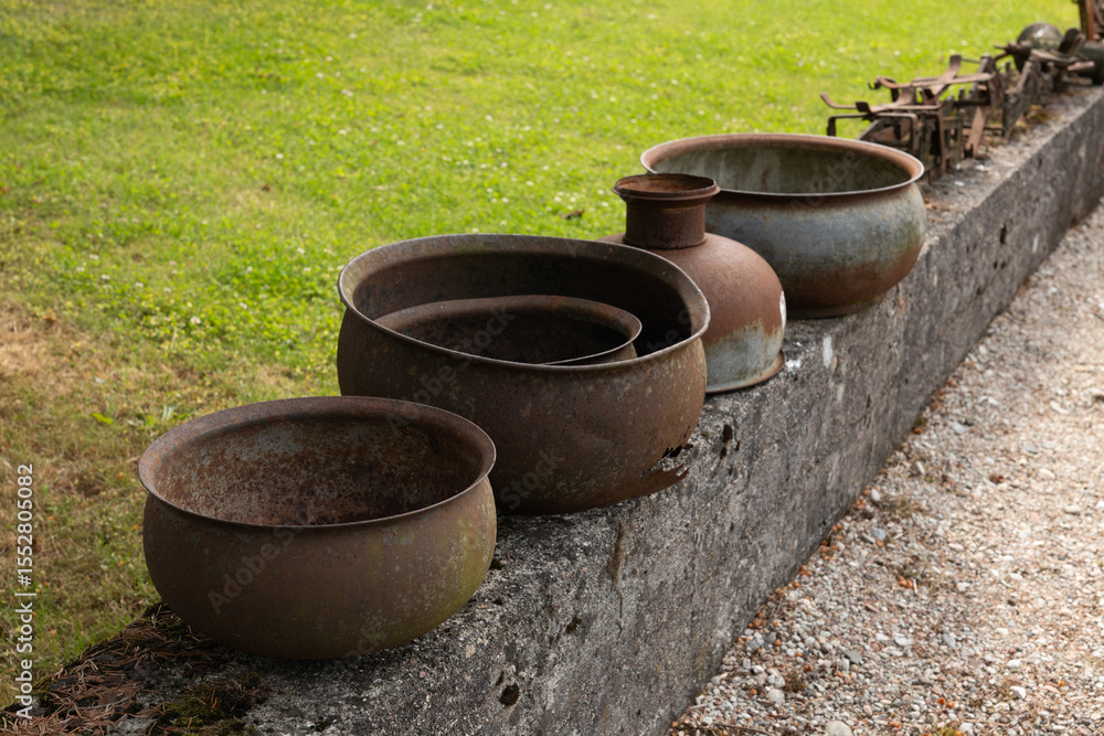 old rusty pots in the garden old rusty pots in the garden