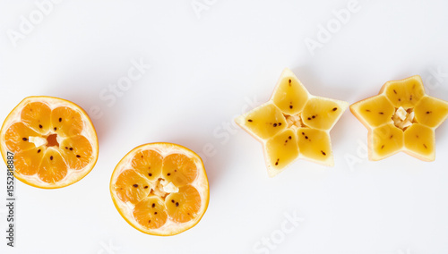 sliced starfruit on light surface, top-down view