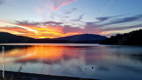 Wallpaper Mural Colorful sunset over a calm lake with mountains Torontodigital.ca