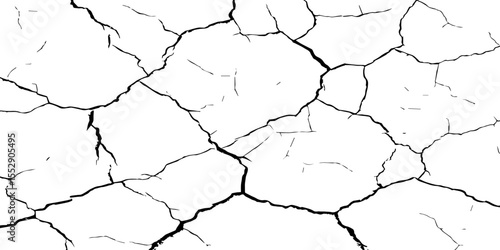 A close-up, high-contrast, black and white image of a cracked surface. The intricate network of cracks, ranging from thick, deep fissures to fine, branching lines, creates a stark and textured pattern