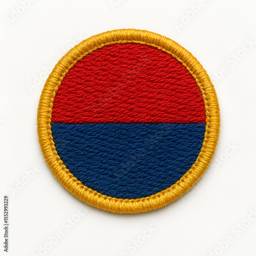 Circular Embroidered Patch with Red and Blue Halves and Golden-Yellow Border – Dense Textured Stitching, Bold Color Contrast, Textile Badge Isolated on Neutral Background