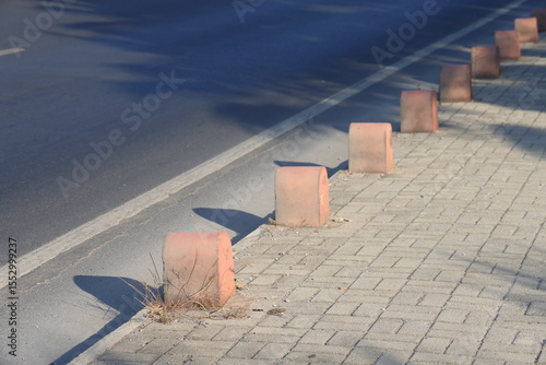 Gray curb on background of flowers, minimalism, path in the park, 7