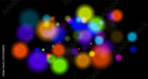 Multicolored glowing circles on dark background. Blurred soft shapes of various sizes create abstract festive atmosphere.
