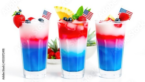 Three layered red white and blue drinks garnished with berries and american flags on a white background