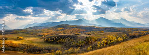 Vast prairie and forest in beautiful autumn sunlight on mountains. Fall color landscape background. Waterton Lakes National Park, Alberta, Canada.
