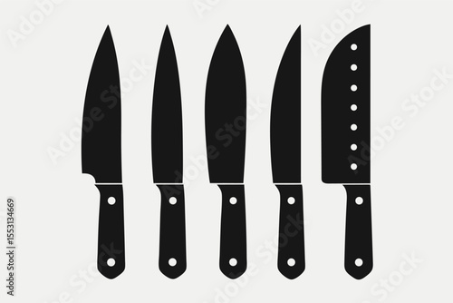 Minimalistic black kitchen knives are lined up neatly against a white background with handles