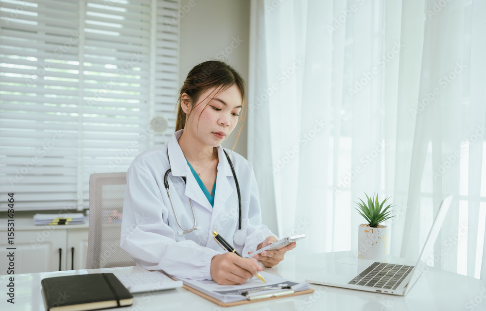A professional in medical attire is diligently reviewing documents on a clipboard while also engaging with a laptop. A professional in medical attire is diligently reviewing documents on a clipboard while also engaging with a laptop.