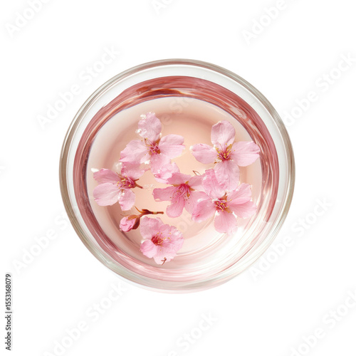 Overhead View of Cherry Blossoms Floating in a Glass of Water