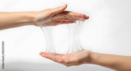 Transparent goo flowing between two fair skinned hands against a white background, Aesthetic viscous liquid demonstration with skin texture, light and shadow