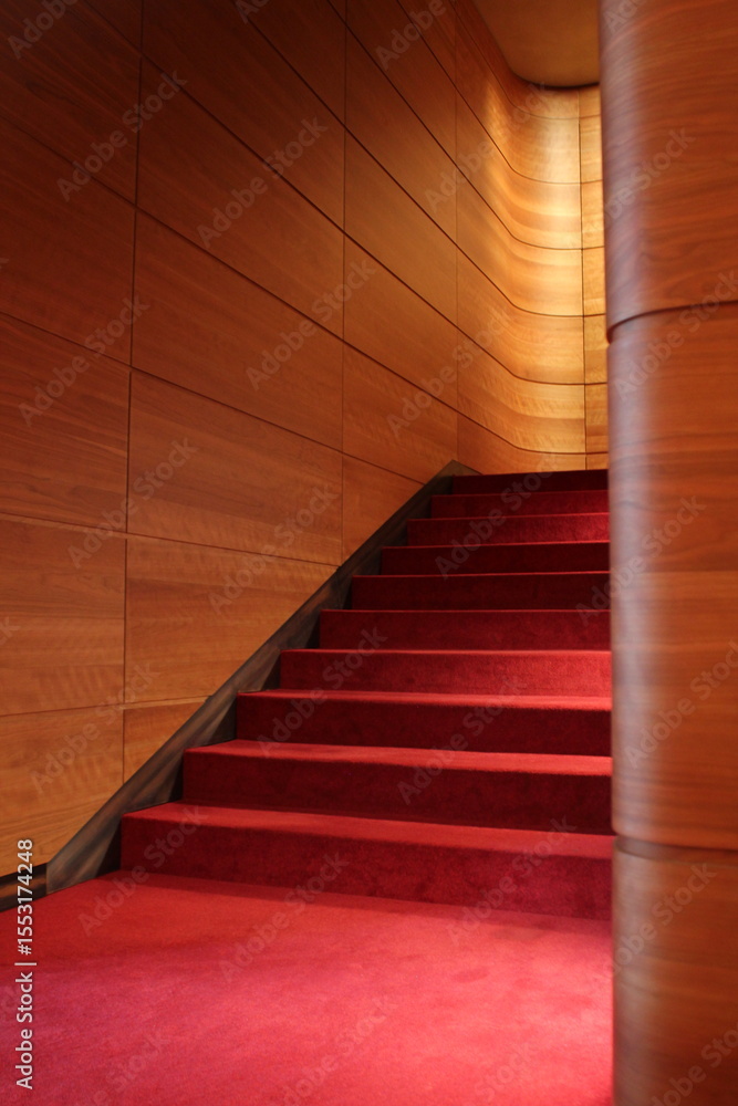 Obraz premium Theater staircase with red carpet and wooden wall