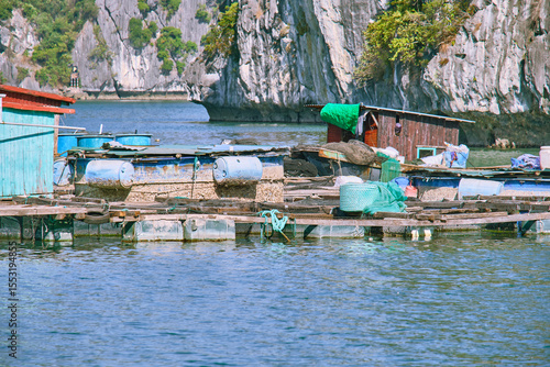 Halong Bay, a UNESCO World Heritage Site, during daytime. A floating village of fishermen.