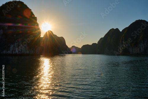 Vietnam, Halong Bay, UNESCO World Heritage Site, during sunset.