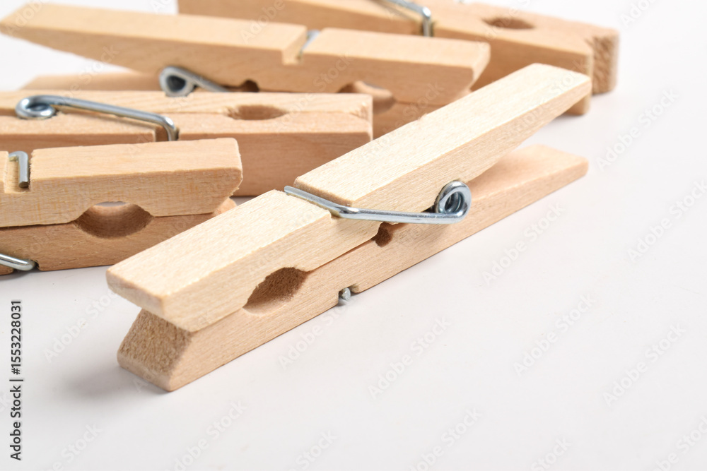 Wooden clothes pegs isolated on white background Wooden clothes pegs isolated on white background