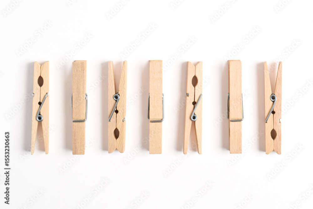 Wooden clothes pin isolated on white background. Top view, flat lay Wooden clothes pin isolated on white background. Top view, flat lay