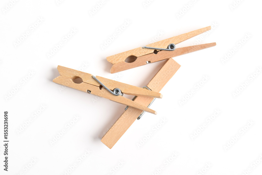 Wooden clothes pin isolated on white background. Top view, flat lay Wooden clothes pin isolated on white background. Top view, flat lay