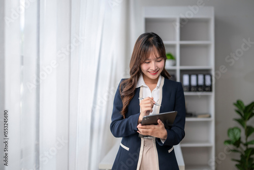 Free Download Young asian businesswoman working with tablet and pen in office - GFXLoad