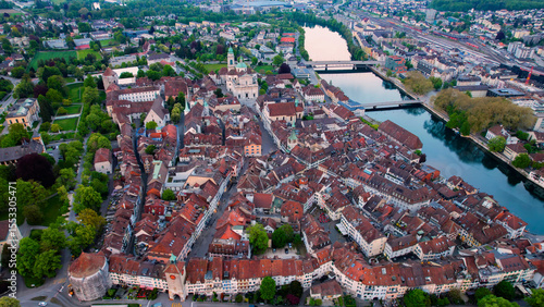 A panoramic aerial view around the old town of the city Solothurn in Switzerland on a sunny spring noon