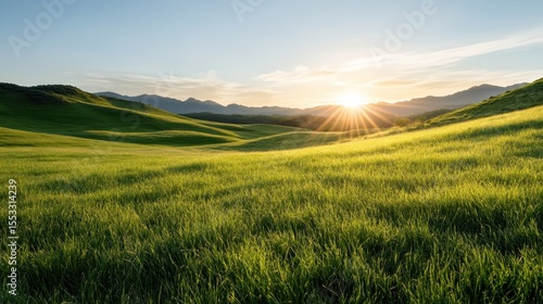 A breathtaking sunset illuminating rolling hills in a vibrant landscape, evoking feelings of tranquility and beauty as nature transitions from day to night with stunning colors.
